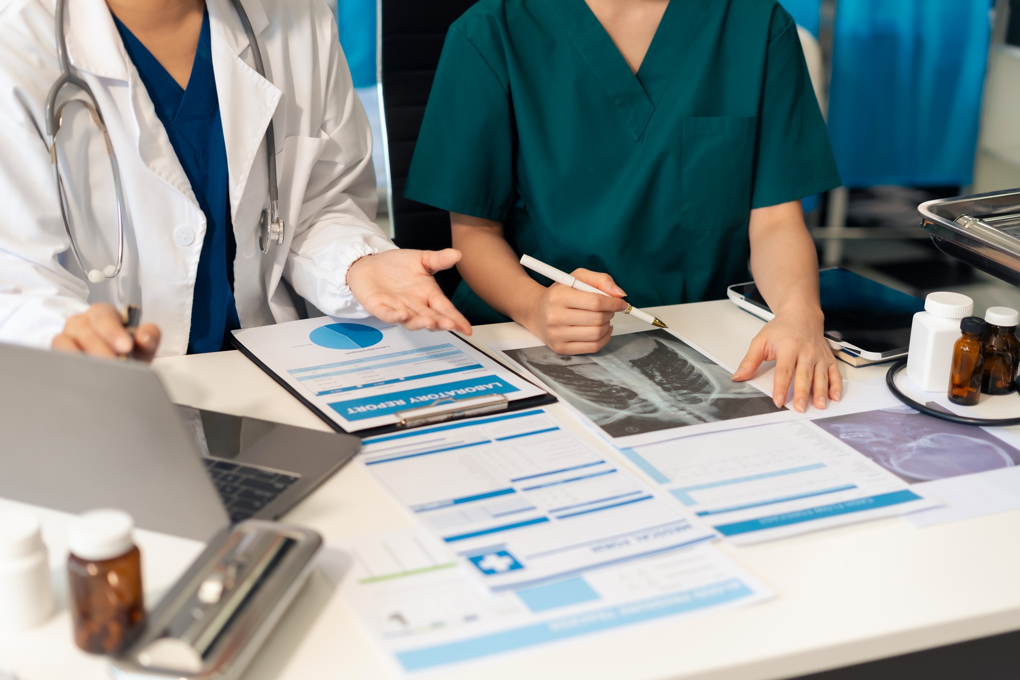 Medical team working analyzed the results of medical reports.