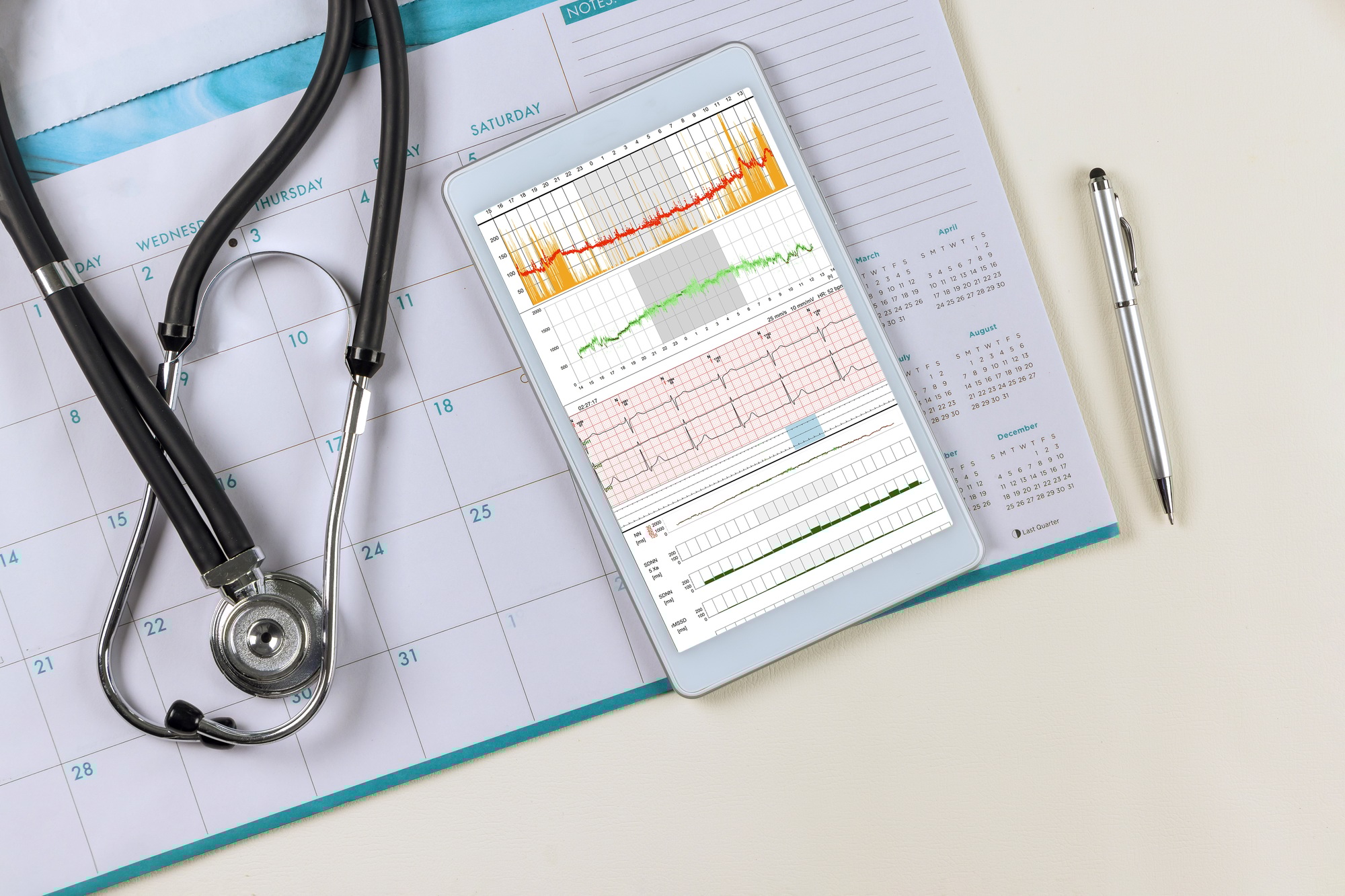 Medical worktable doctor desk with heart cardiogram of wave on cardiography heart report analysis th
