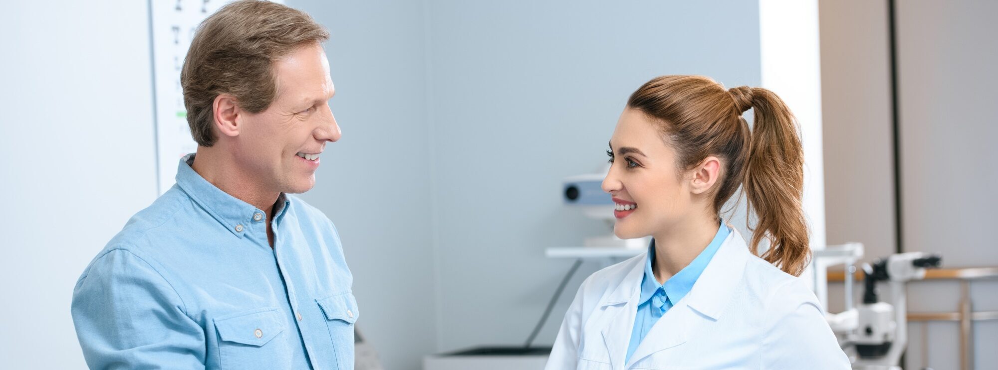 middle aged man shaking hands with female doctor after consultation in clinic