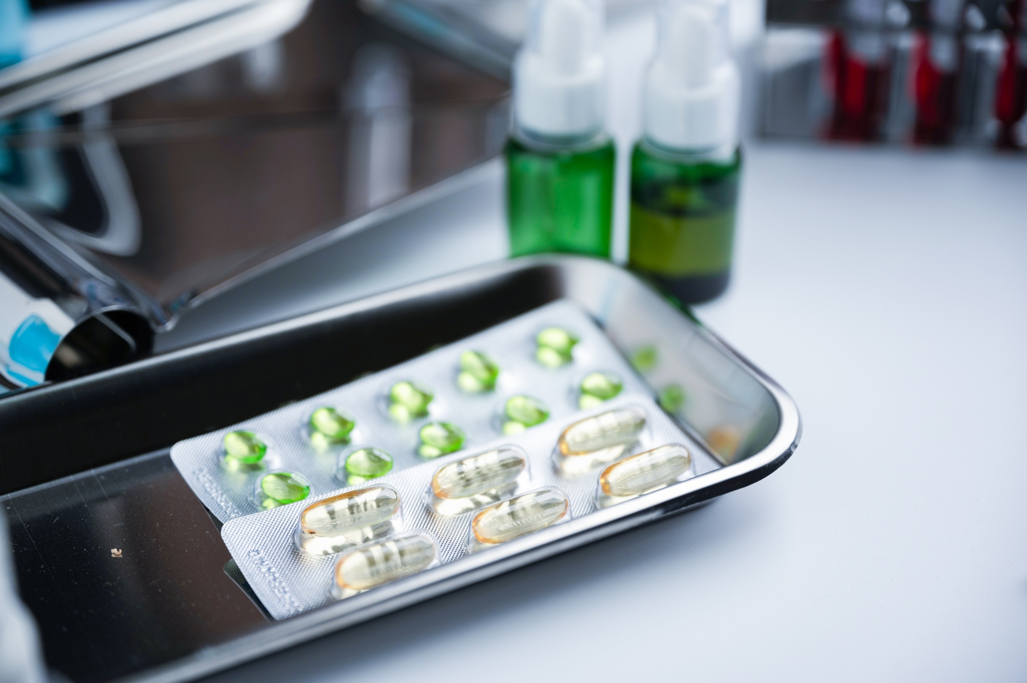 Tray of medicine filled with capsules and medicine strips with test tubes
